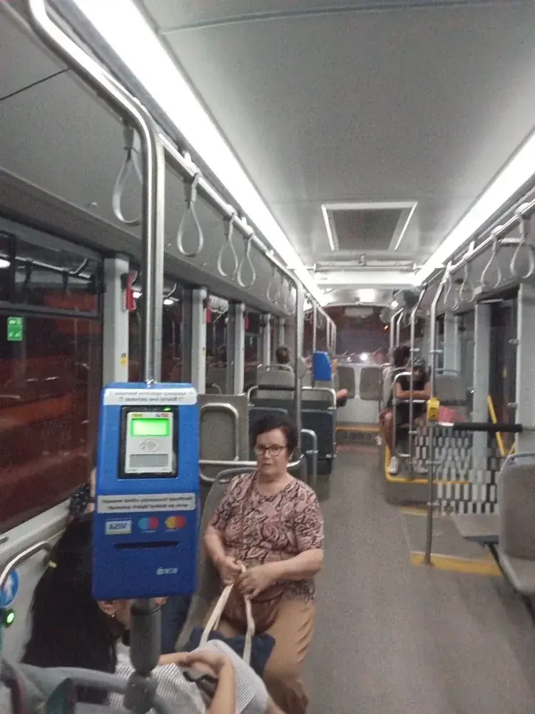 Inside a newer bus — the blue machine takes contactless bank cards, Visa and Mastercard logos on the front