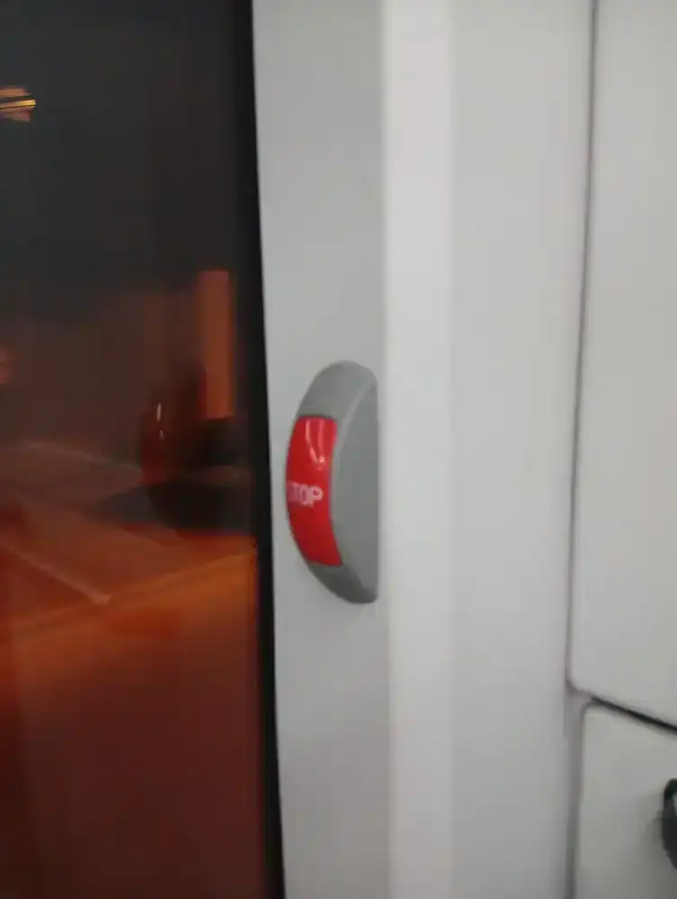 The STOP request button by the door