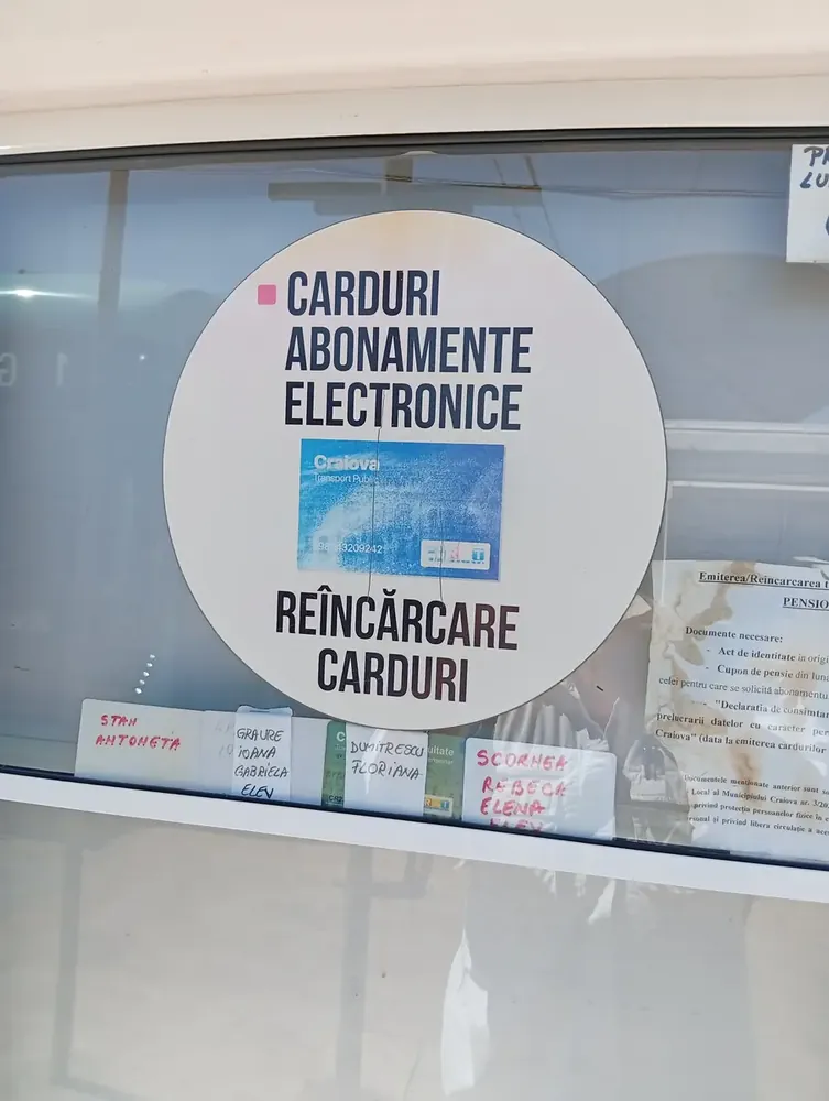 What to look for: the CARDURI ABONAMENTE ELECTRONICE sign marks a kiosk that issues and reloads the blue travel card