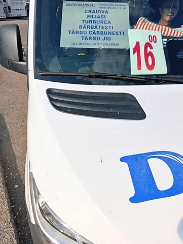 Daverotrans minibus windscreen sign at Craiova North Bus Station: Craiova–Filiași–Turburea–Bărbătești–Târgu Cărbunești–Târgu Jiu, departures 05:30 and 11:30, Monday to Friday, 13 August 2026