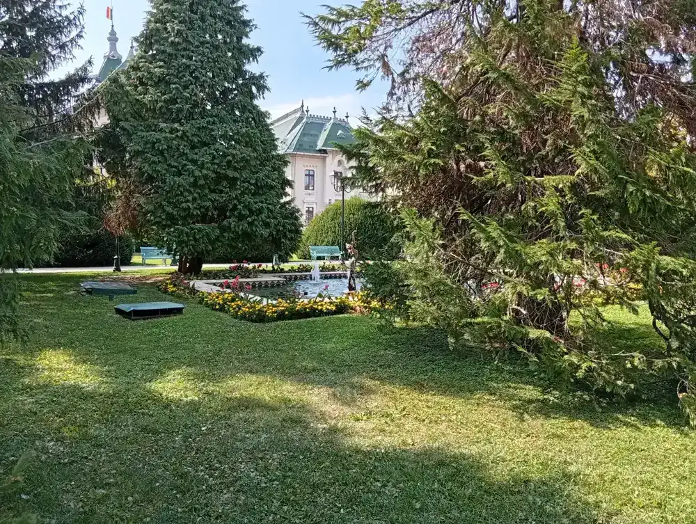 The pool and the green roofs over the trees