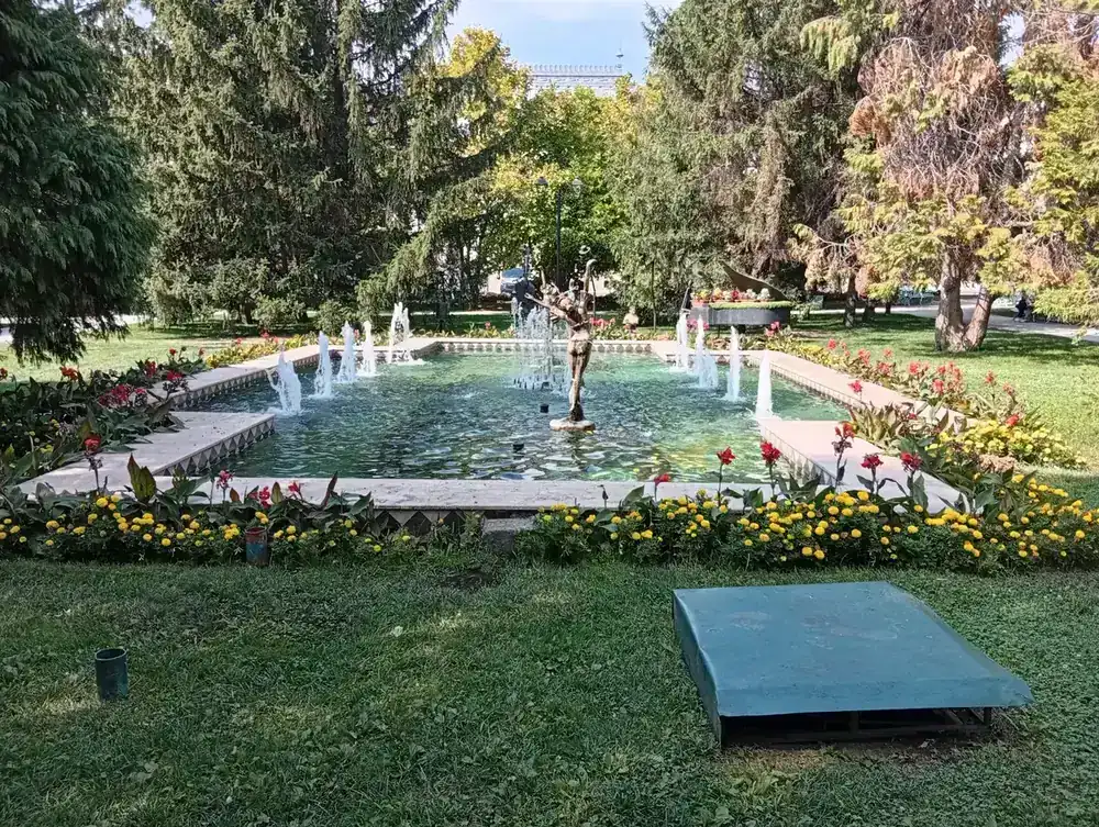 The pool, jets and the bronze dancer
