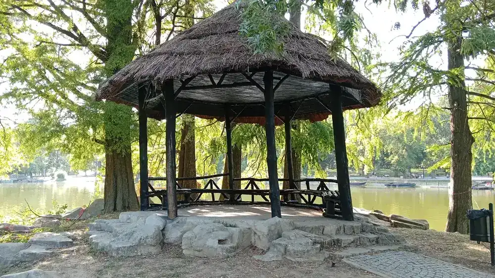 A thatched shelter on the lake shore