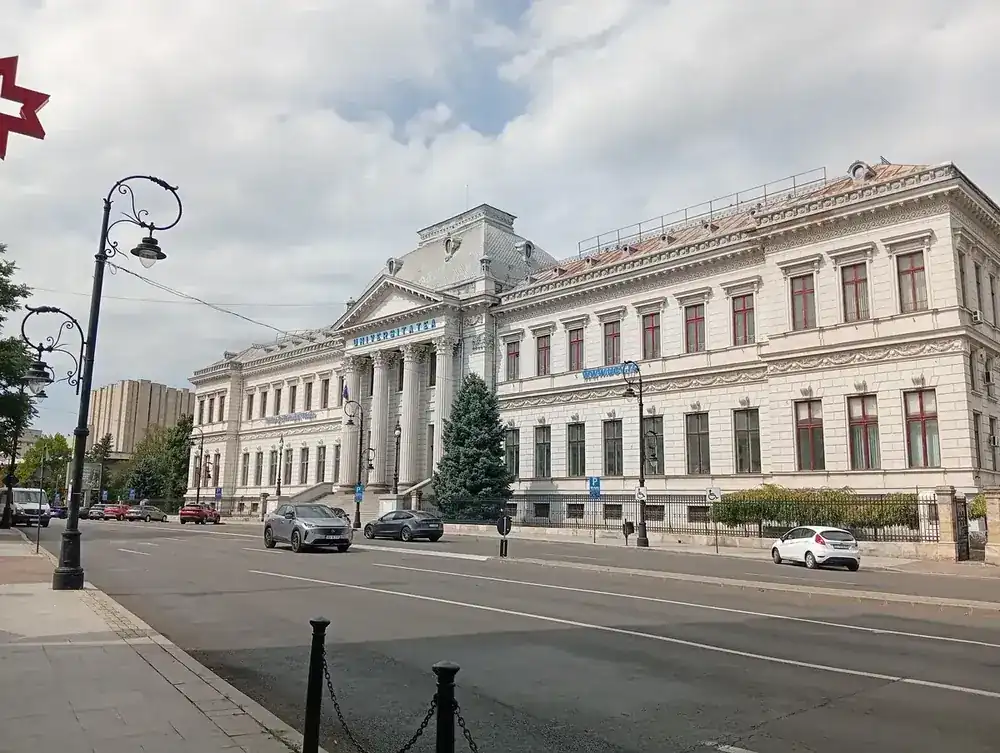 The main building of the University of Craiova on Strada Alexandru Ioan Cuza — white neoclassical facade with columns