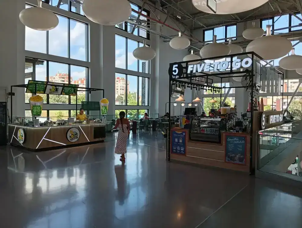Coffee and snack counters on the upper level, daylight the whole way