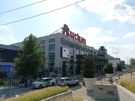 Electroputere Mall in Craiova from the street, the Auchan sign above the entrance