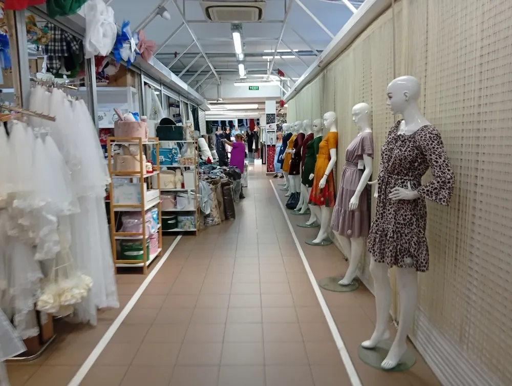 Dresses on the mannequin line, wedding and party goods on the other side
