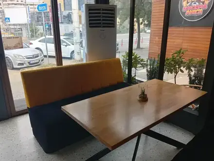 The room at Amicii Caffe, Craiova, looking down the tables to the bar