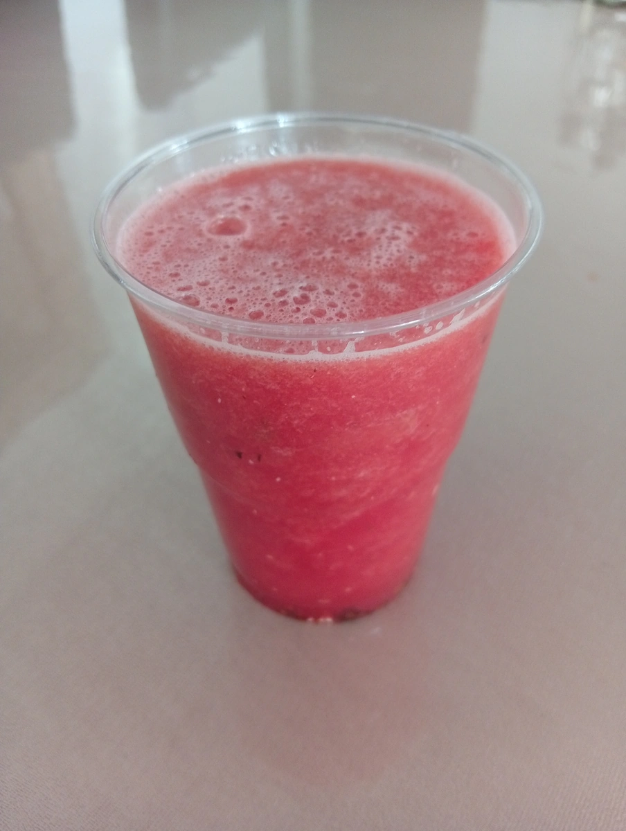 Watermelon juice, pressed to order and poured with the froth still on it