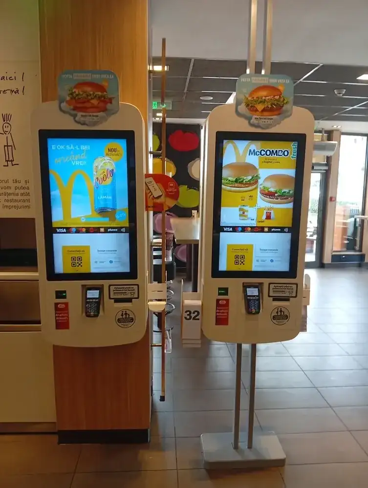 The touch kiosks — card, contactless, Up and Pluxee meal cards