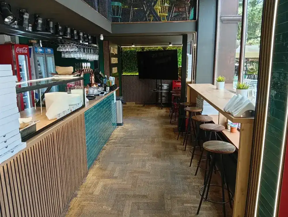 The counter, bar stools along the window